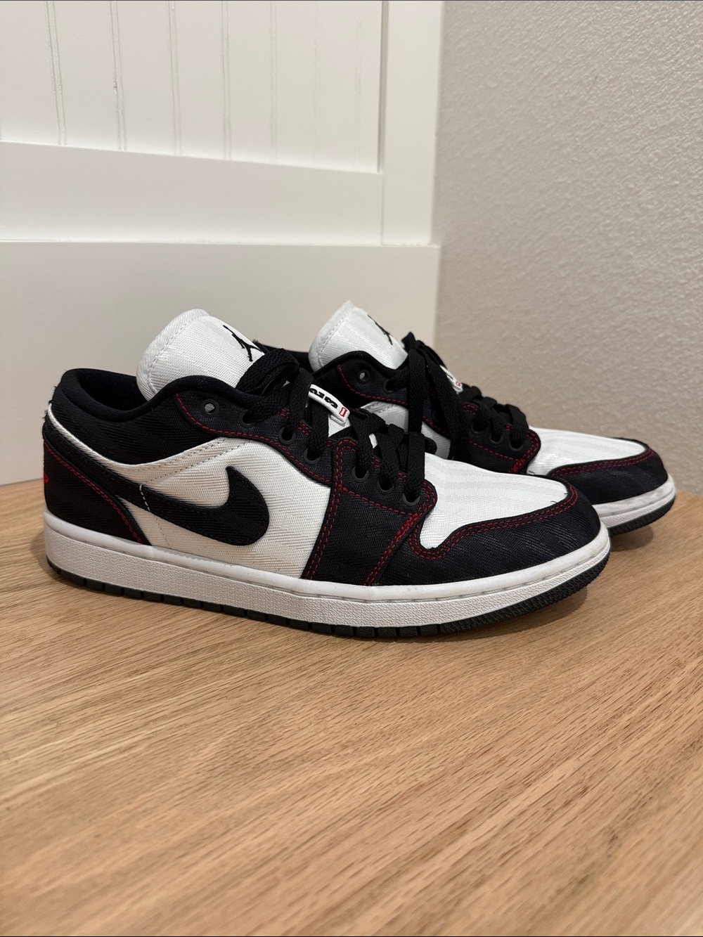 Jordan Low-Top Sneakers in Black, White & Red Stitching